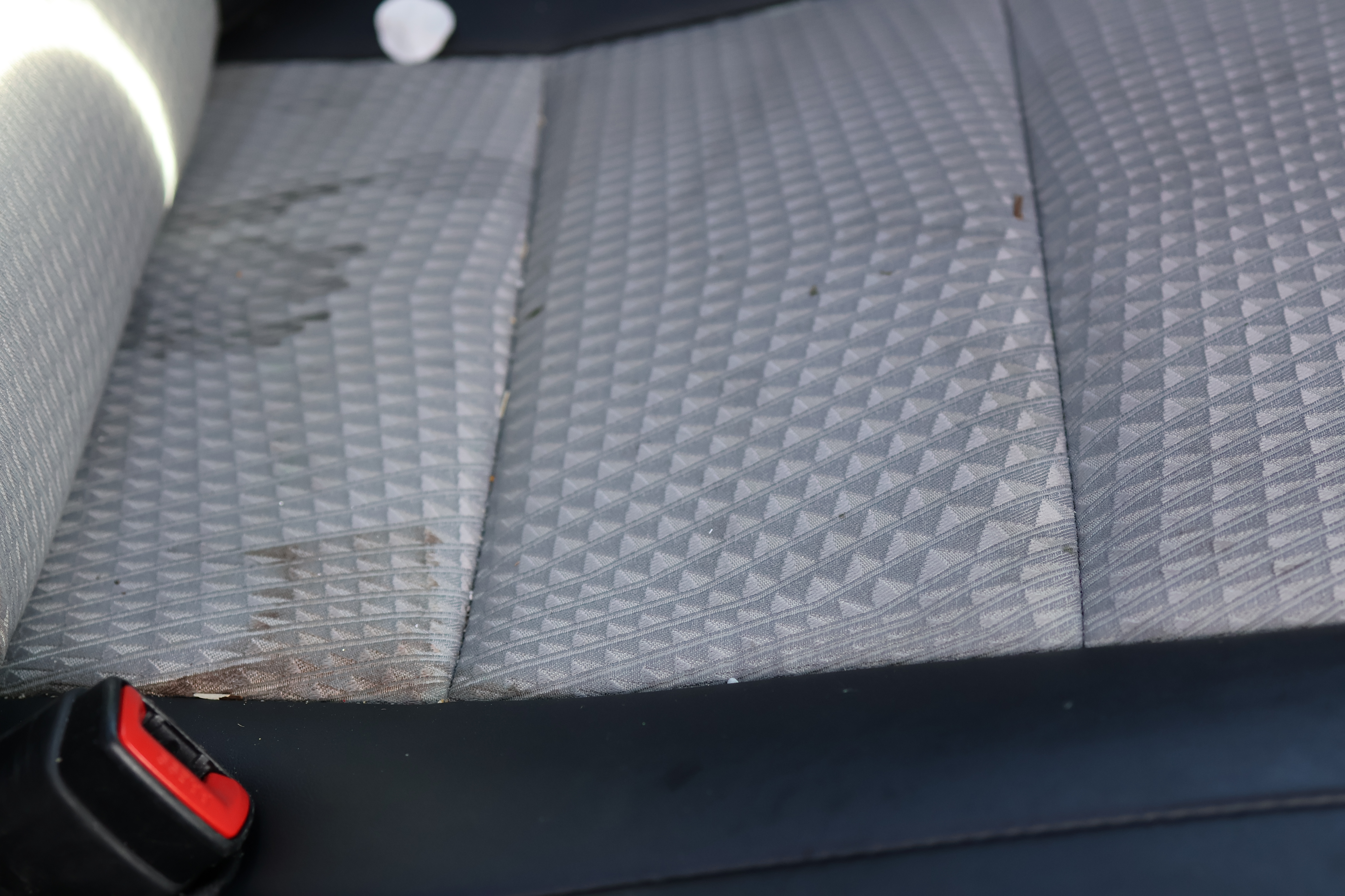 Toyota Camry rear seat before interior renew - chocolate milk stain