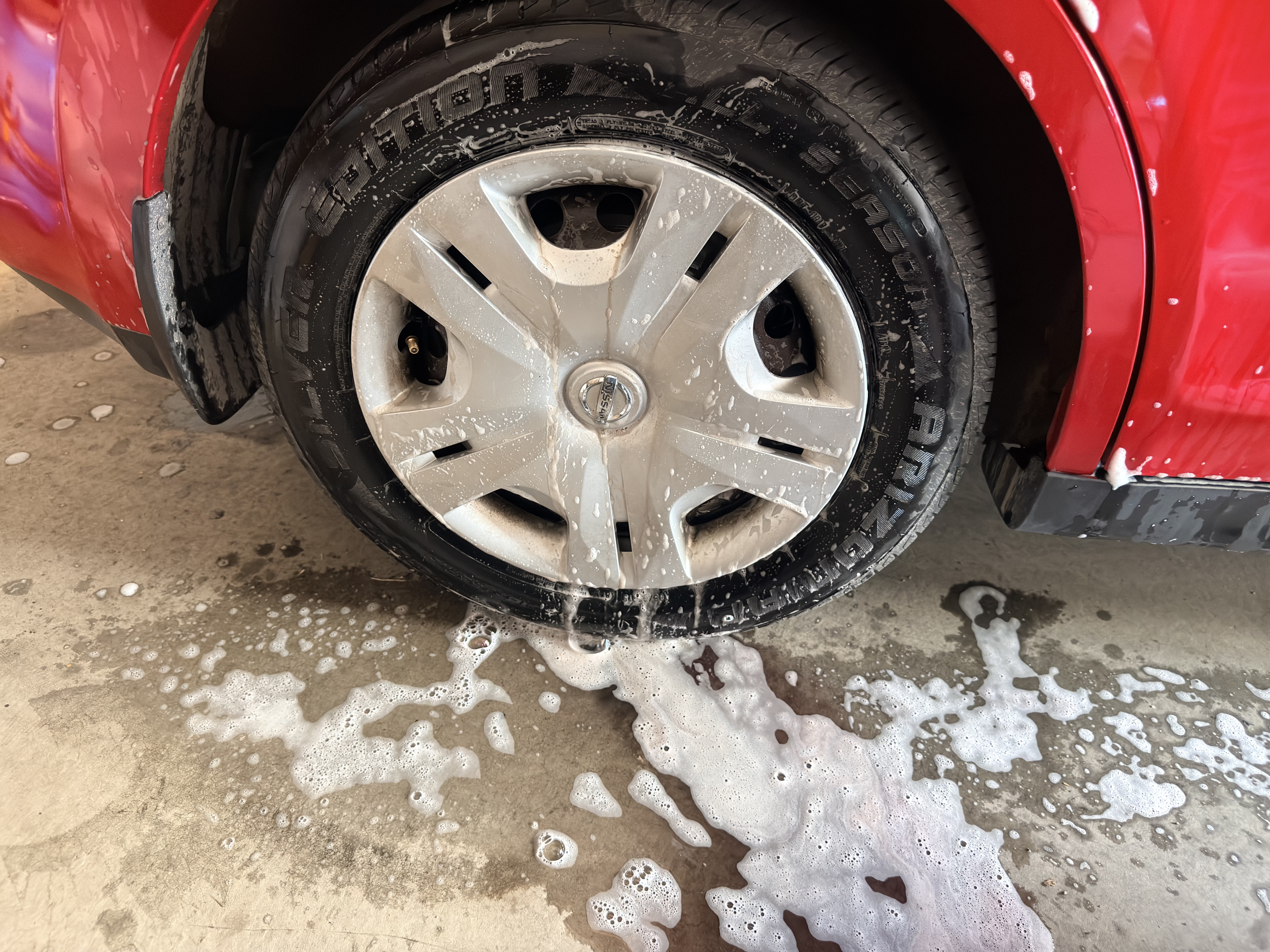 Nissan Versa wheel during cleaning process
