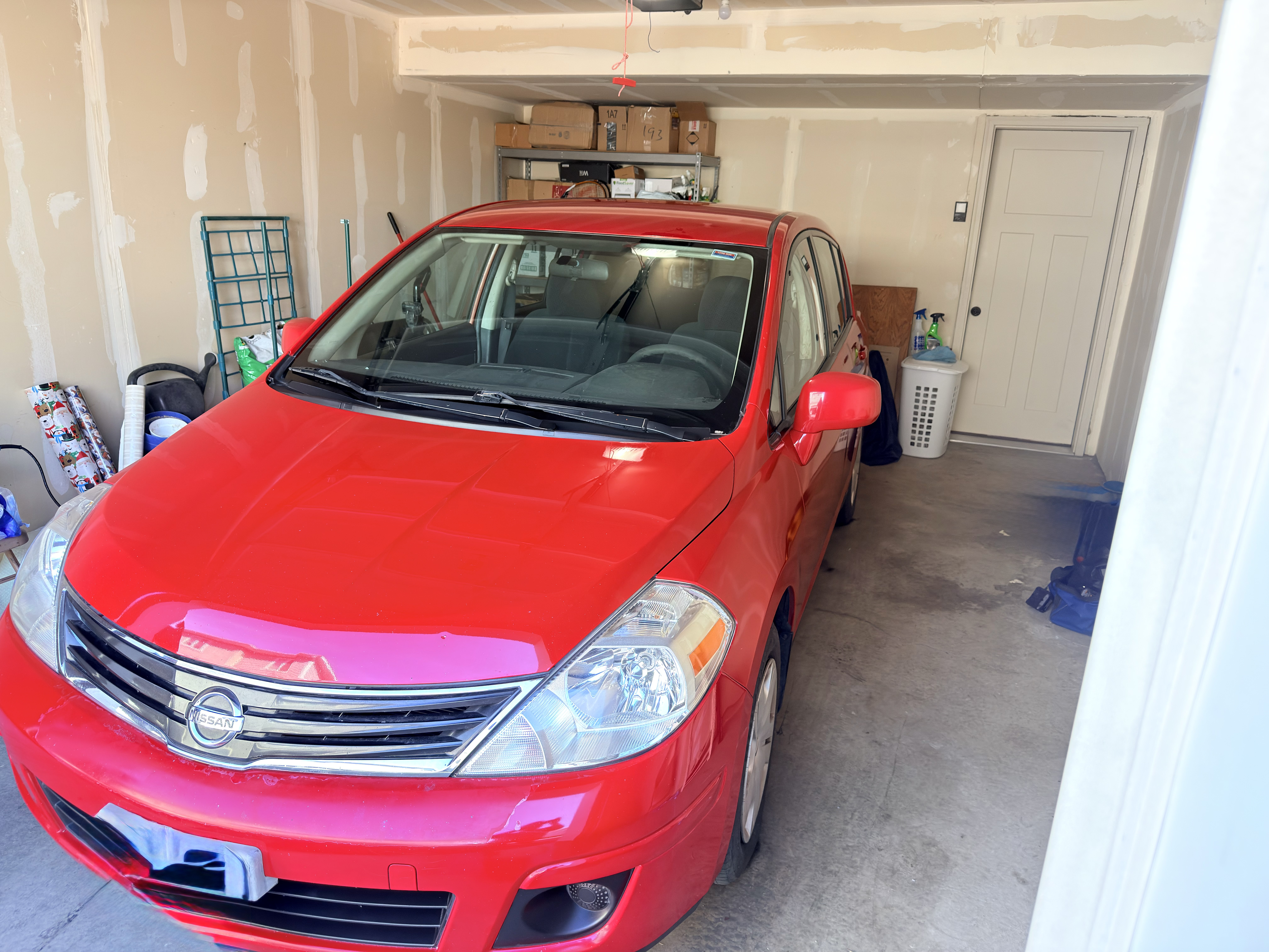Red Nissan Versa after Platinum Graphene Gloss - front view