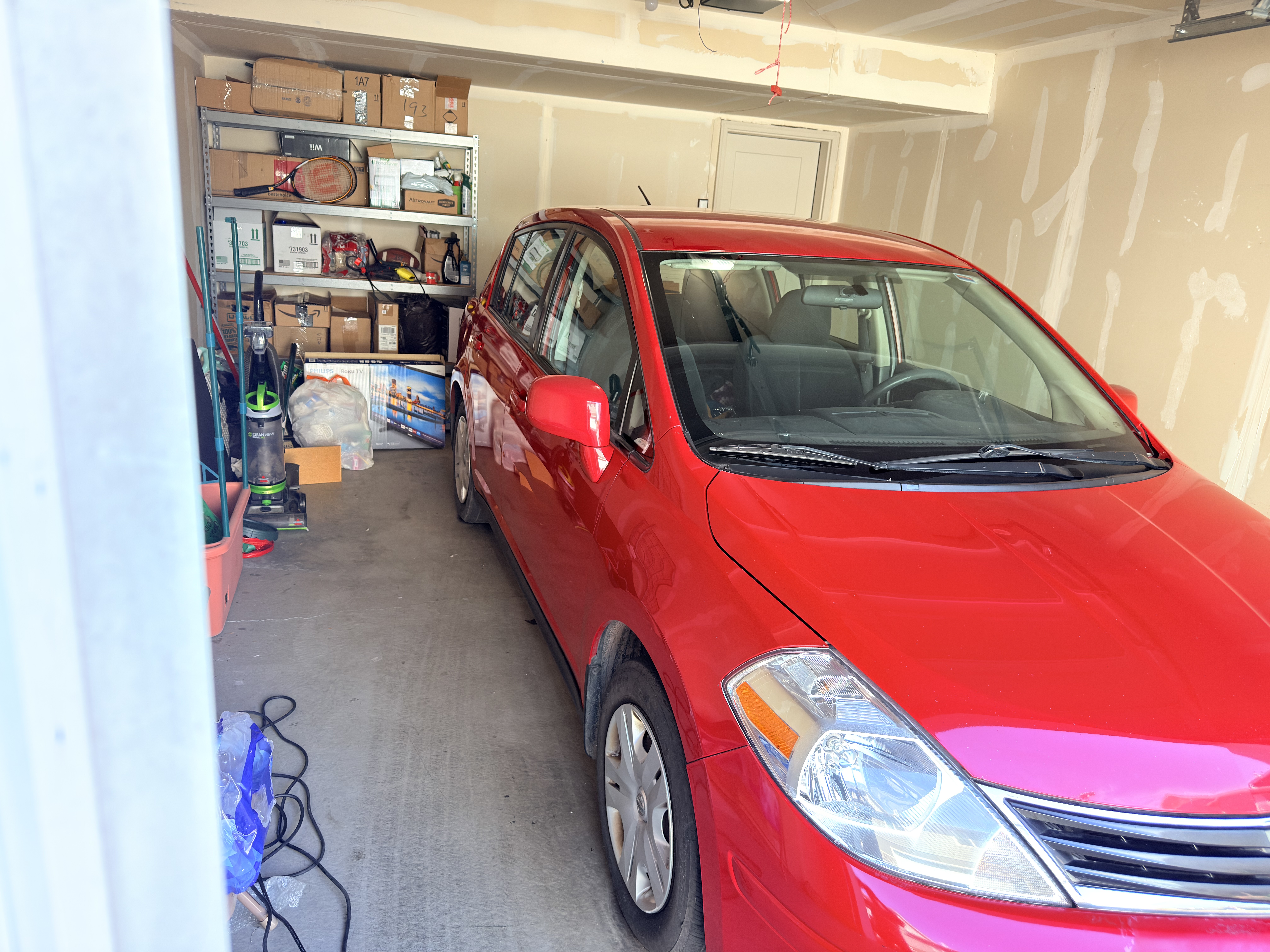 Red Nissan Versa after Platinum Graphene Gloss - side view